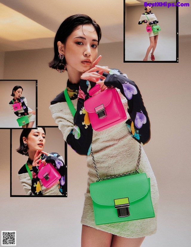 A woman holding a pink and green bag in a magazine.